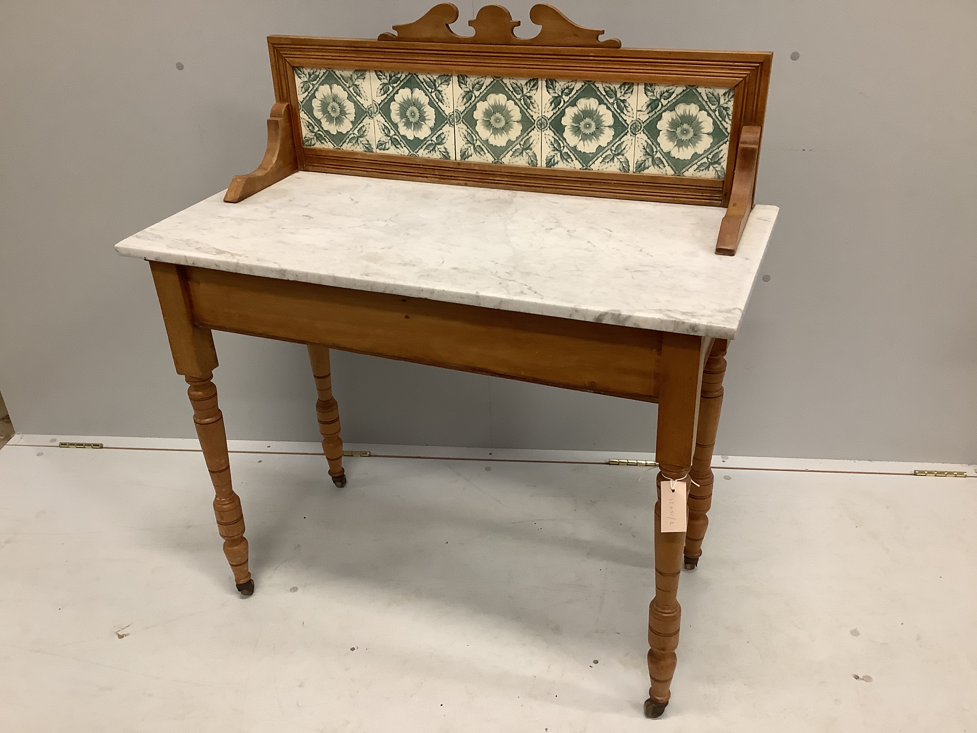 A late Victorian satin birch marble topped wash stand with tiled back, width 91cm, depth 44cm, height 102cm